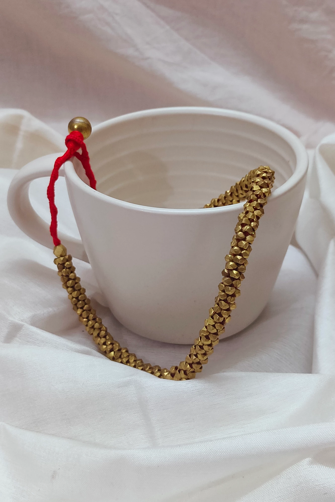 The Brass Charm (Red)