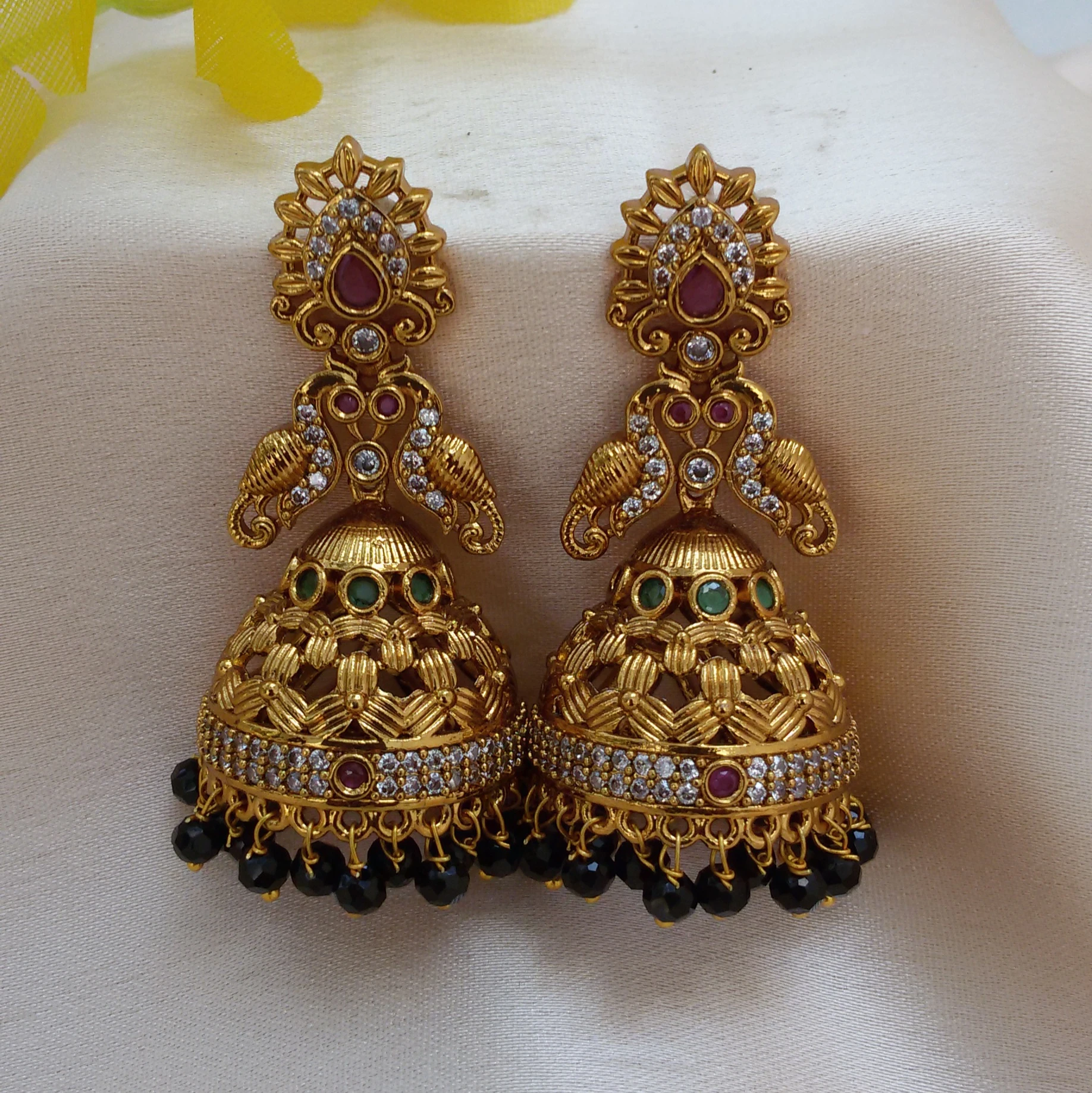 Gold plated white stone peacock Jhumkis