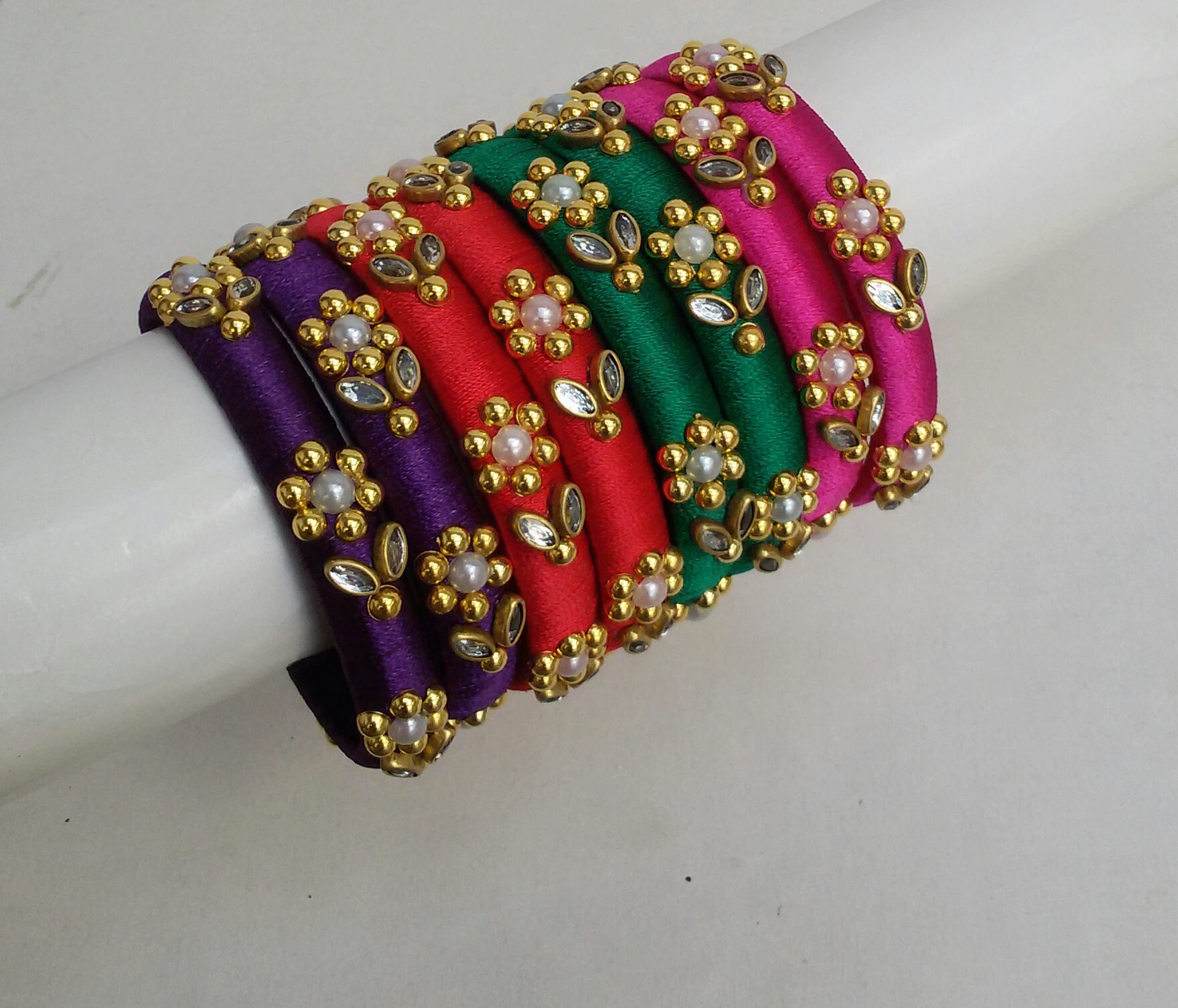 Hand crafted silk thread bangles with golden flowers