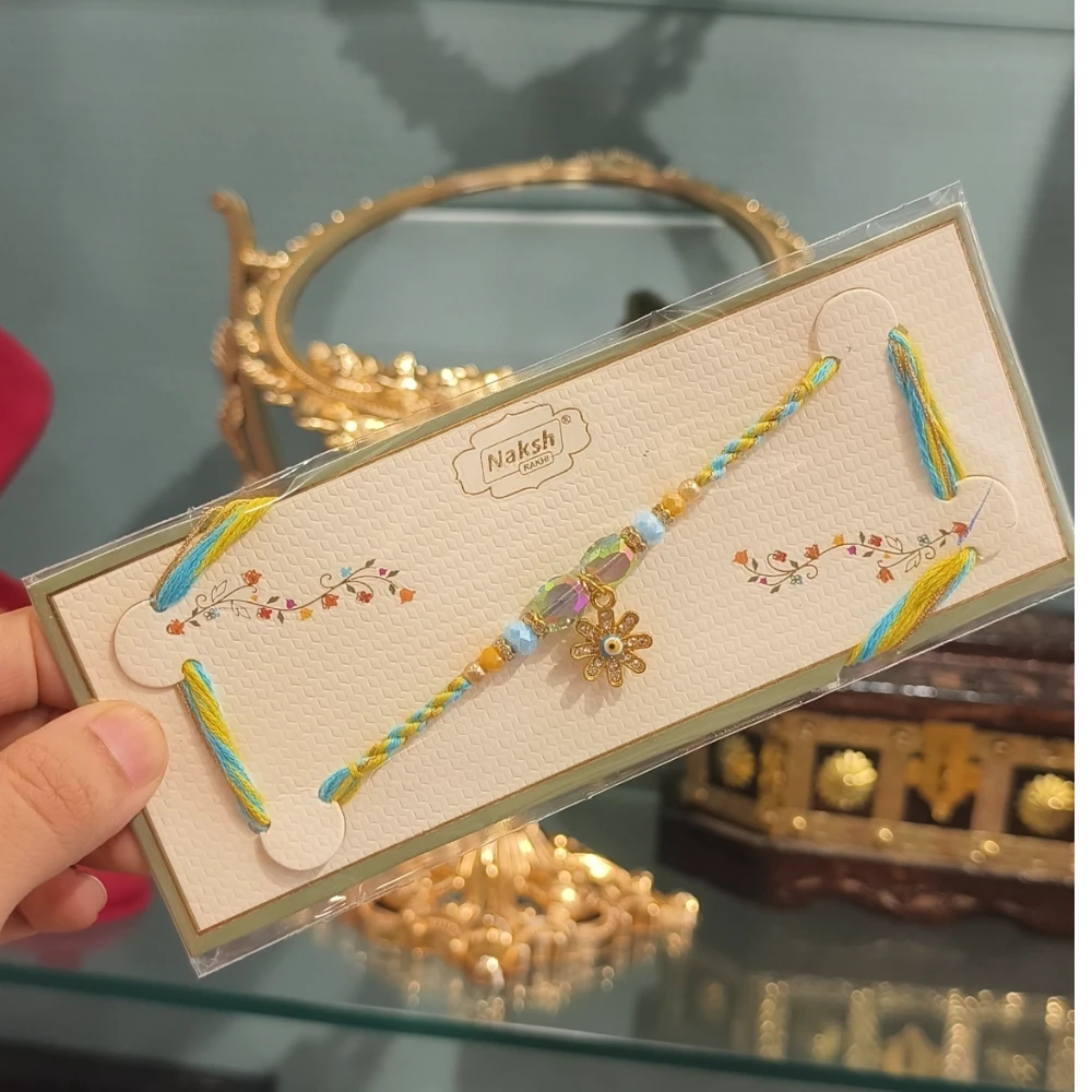 RIA FLOWER YELLOW BLUE EVIL EYE LUMBA  RAKHI A38