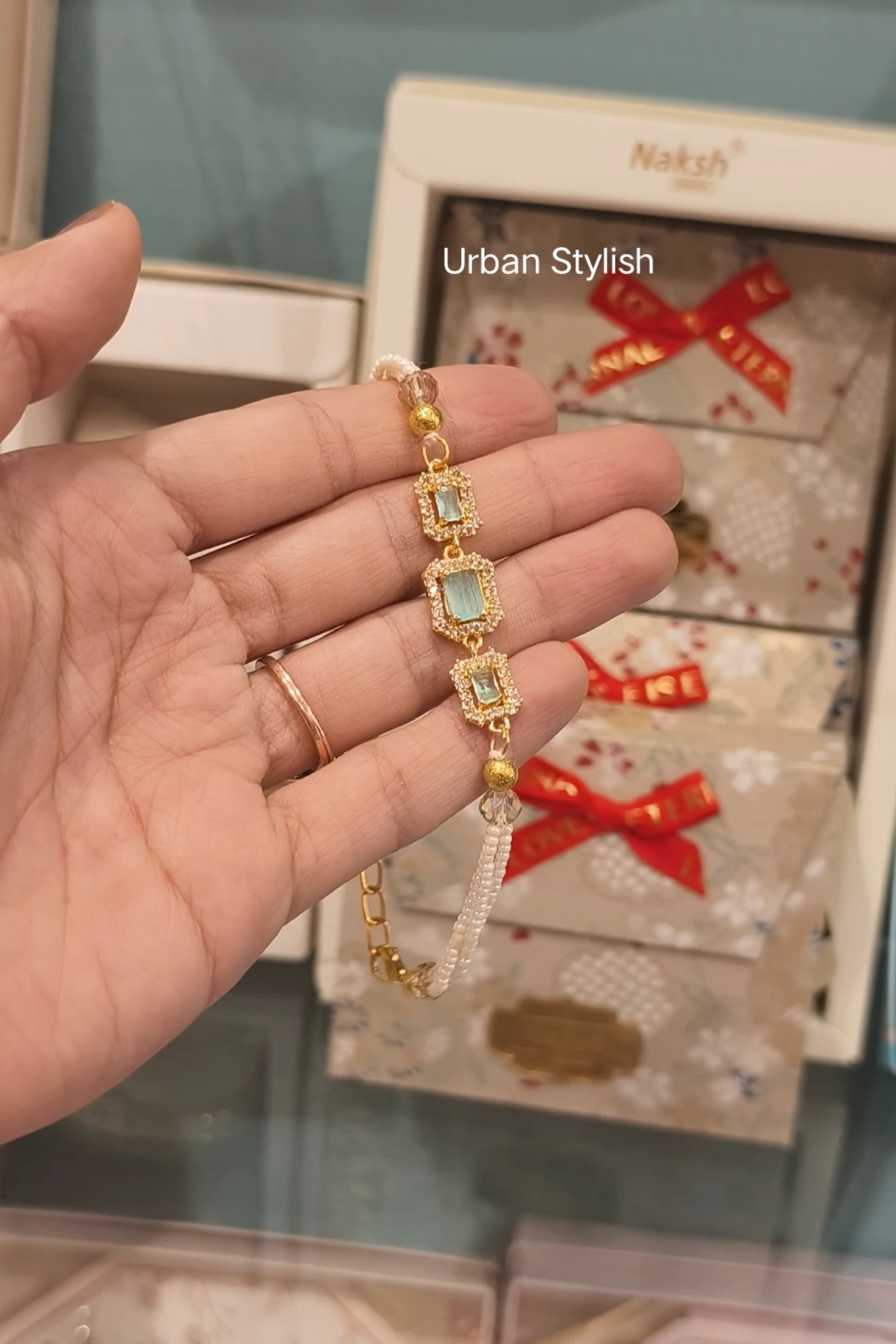 SOFIA GOLDEN SILVER C GREEN RAKHI (7422)