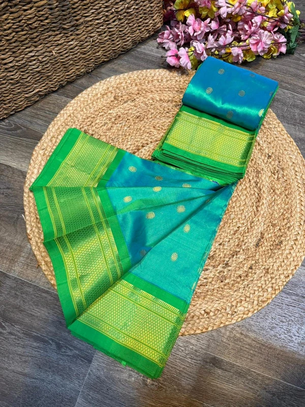 Exclusive Parrot Green Paithani self color pure silk saree with gold zari border, traditional Meena butta weaving and handwoven craftsmanship.