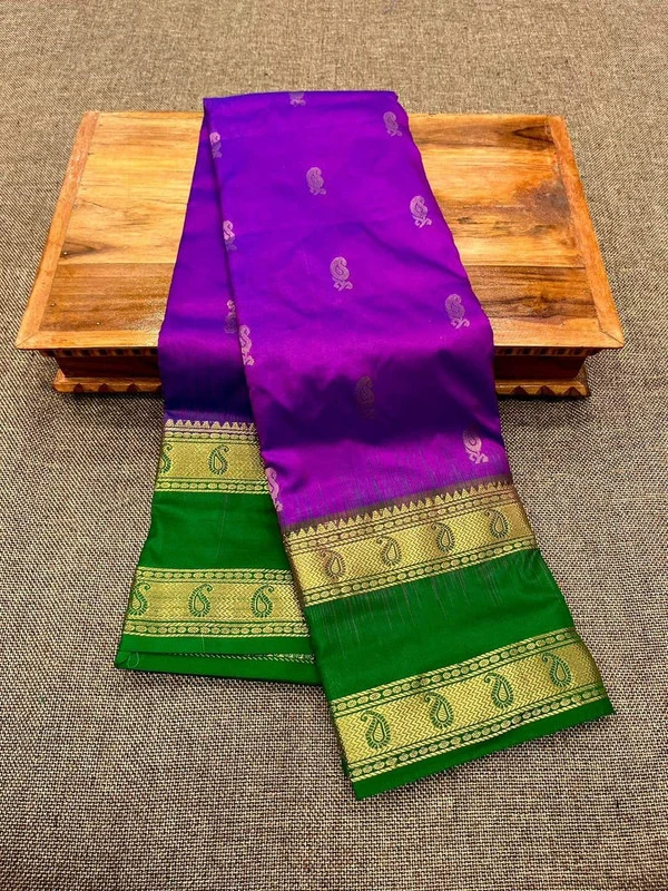Purple silk saree with green Bentex border and gold paisley motifs.