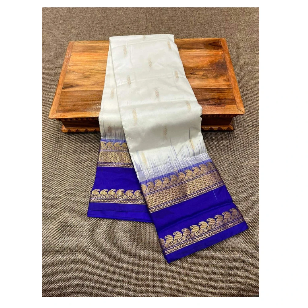 Off-white Kanchipuram silk saree with blue Bentex border and golden motifs.
