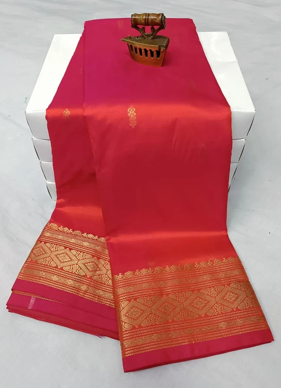 Orange traditional silk saree with zari border for wedding and festive wear