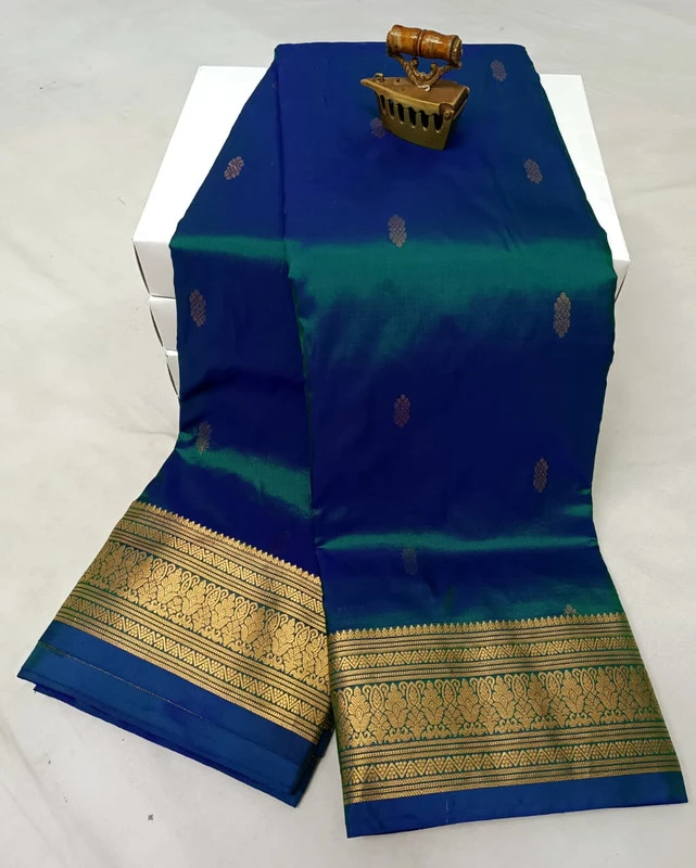Green traditional silk saree with zari border for festive and wedding occasions