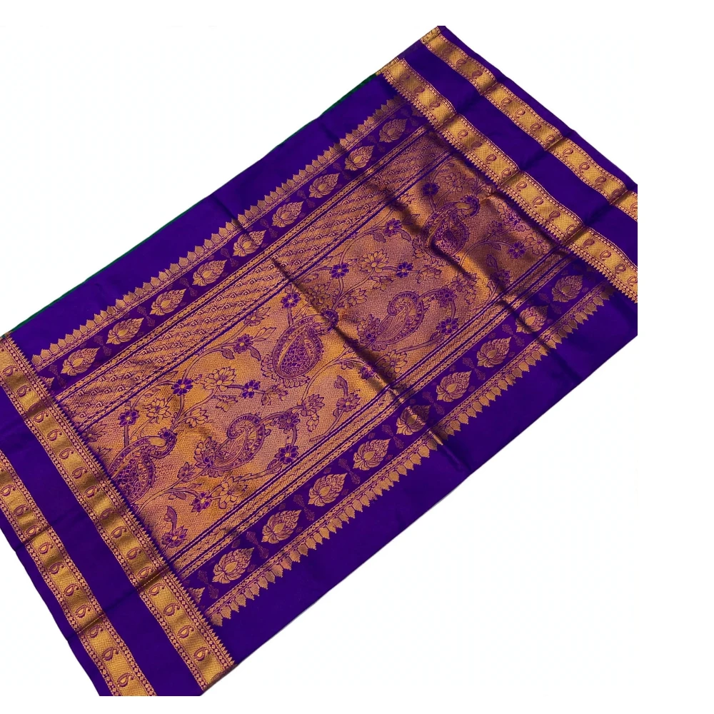 Off-white Kanchipuram silk saree with blue Bentex border and golden motifs.