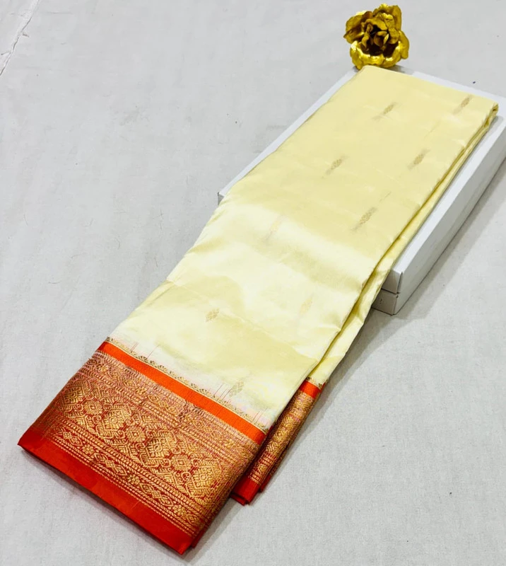 Off-white pure silk Kanchipuram saree with orange and golden zari border