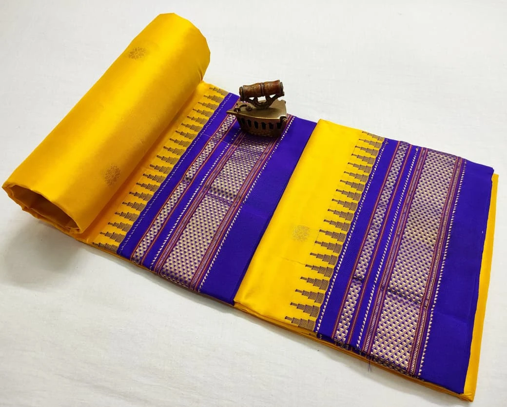 Yellow Ilkaal Butta pure silk saree with zari border and traditional woven patterns