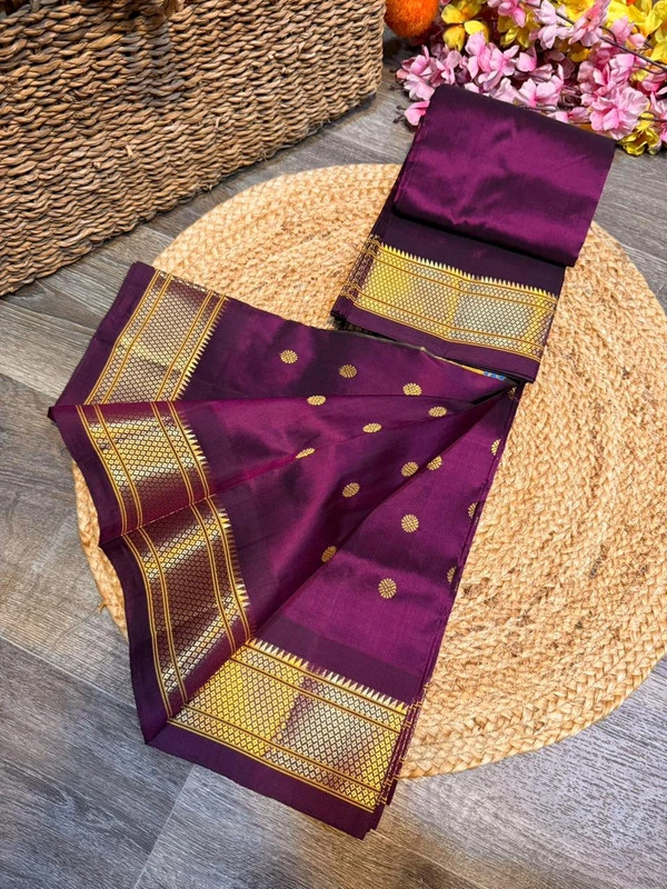 Exclusive Wine Purple Paithani self color pure silk saree with gold zari border, traditional Meena butta weaving and handwoven craftsmanship.