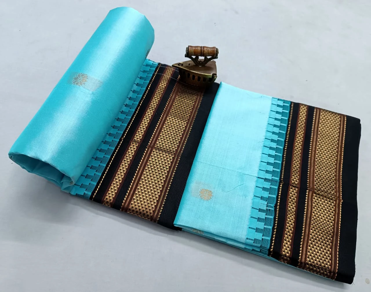 Sky Blue Black Ilkaal Butta pure silk saree with zari border and traditional weaving
