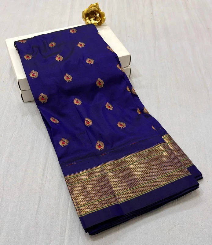Exclusive Royal Violet Paithani self color pure silk saree with gold zari border, traditional Meena butta weaving and handwoven craftsmanship.