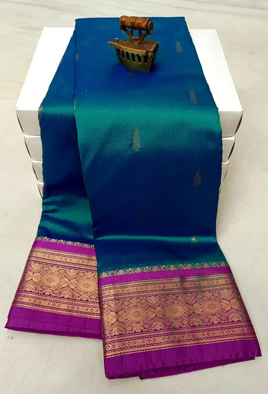 Green and Magenta contrast traditional silk saree with zari border for festive and wedding wear