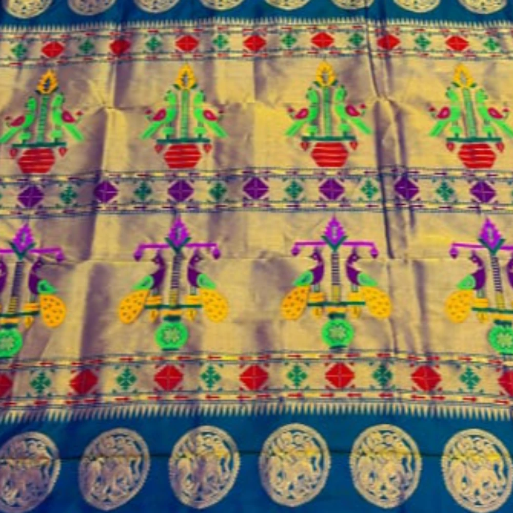 Exclusive Sea Green Paithani self color pure silk saree with gold zari border, traditional Meena butta weaving and handwoven craftsmanship.