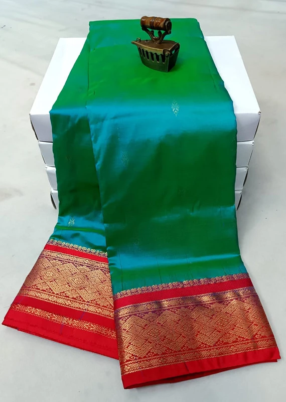 Team Green traditional silk saree with zari border for festive and wedding occasions