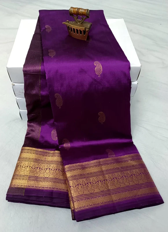 Majenta traditional silk saree with zari border for festive and wedding wear