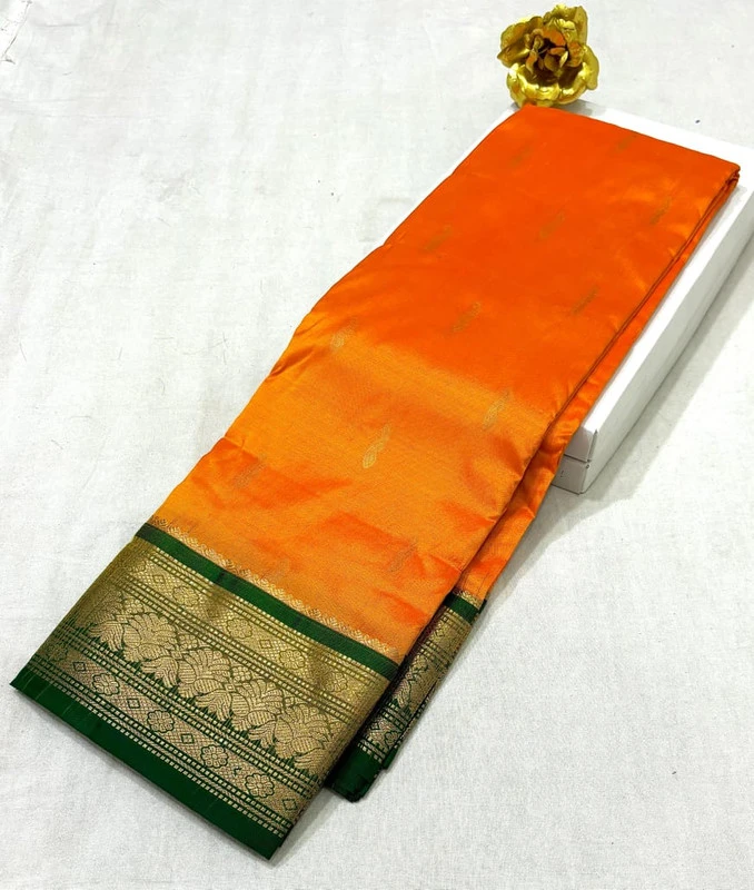 Orange Kanchipuram pure silk saree with blue and gold zari border