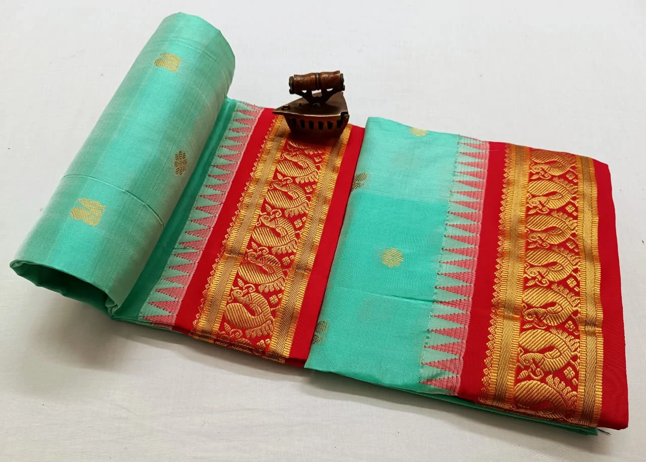 Teal Green traditional silk saree with zari border for festive and wedding occasions
