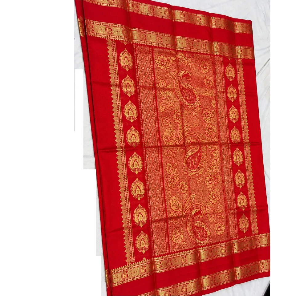 Peach-orange silk saree with red and gold Bentex border and paisley motifs.