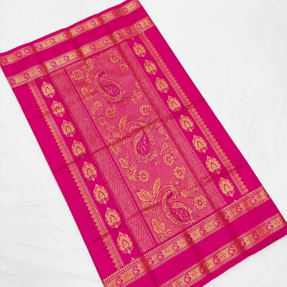 Green Kanchipuram silk saree with pink and gold Bentex border and paisley motifs.