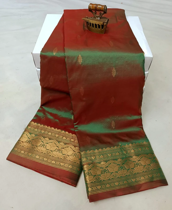 Green traditional silk saree with zari border for festive and wedding occasions