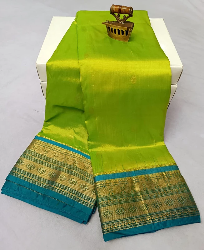 Green traditional silk saree with zari border for wedding and festive wear