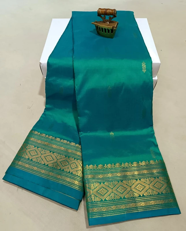 Emerald Green traditional silk saree with zari border for festive and wedding occasions