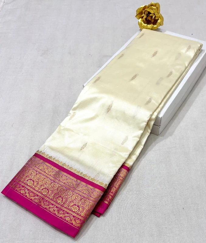Cream pure silk Kanchipuram saree with pink and golden zari border