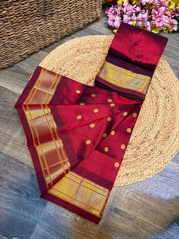 Exclusive Maroon Paithani self color pure silk saree with gold zari border, traditional Meena butta weaving and handwoven craftsmanship.