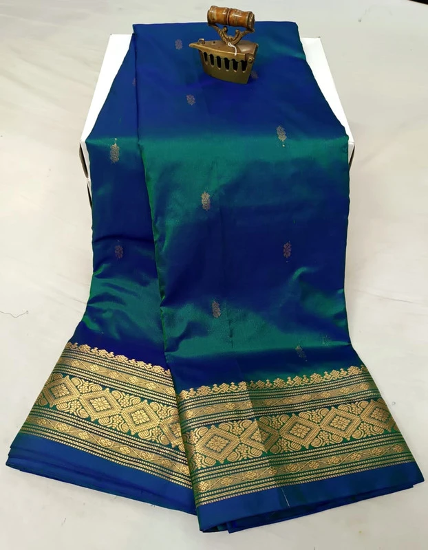 Green traditional silk saree with zari border for festive and wedding occasions