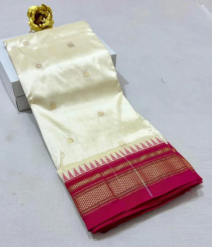 Ivory White pure Ilkaal Butta saree with Pink zari contrast border and traditional gold motifs