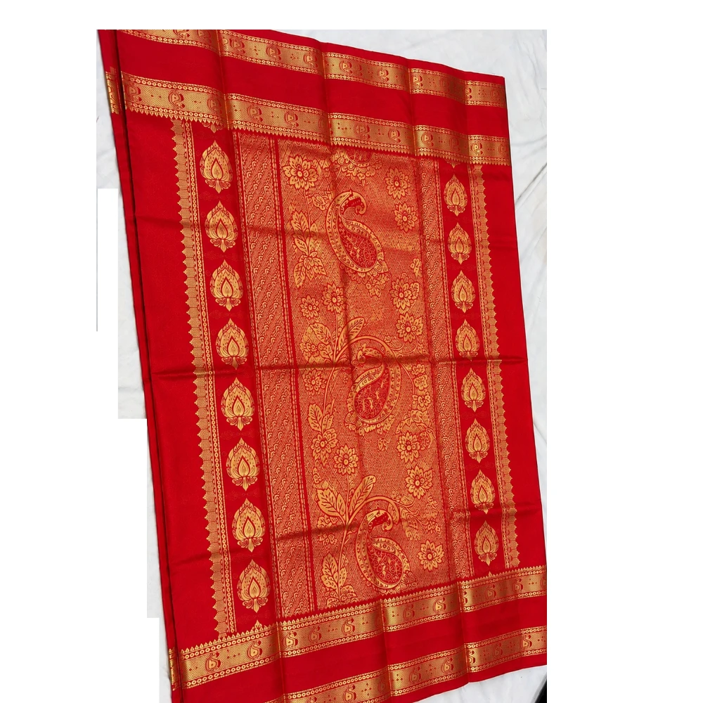 Teal blue silk saree with red Bentex border and gold paisley motifs.