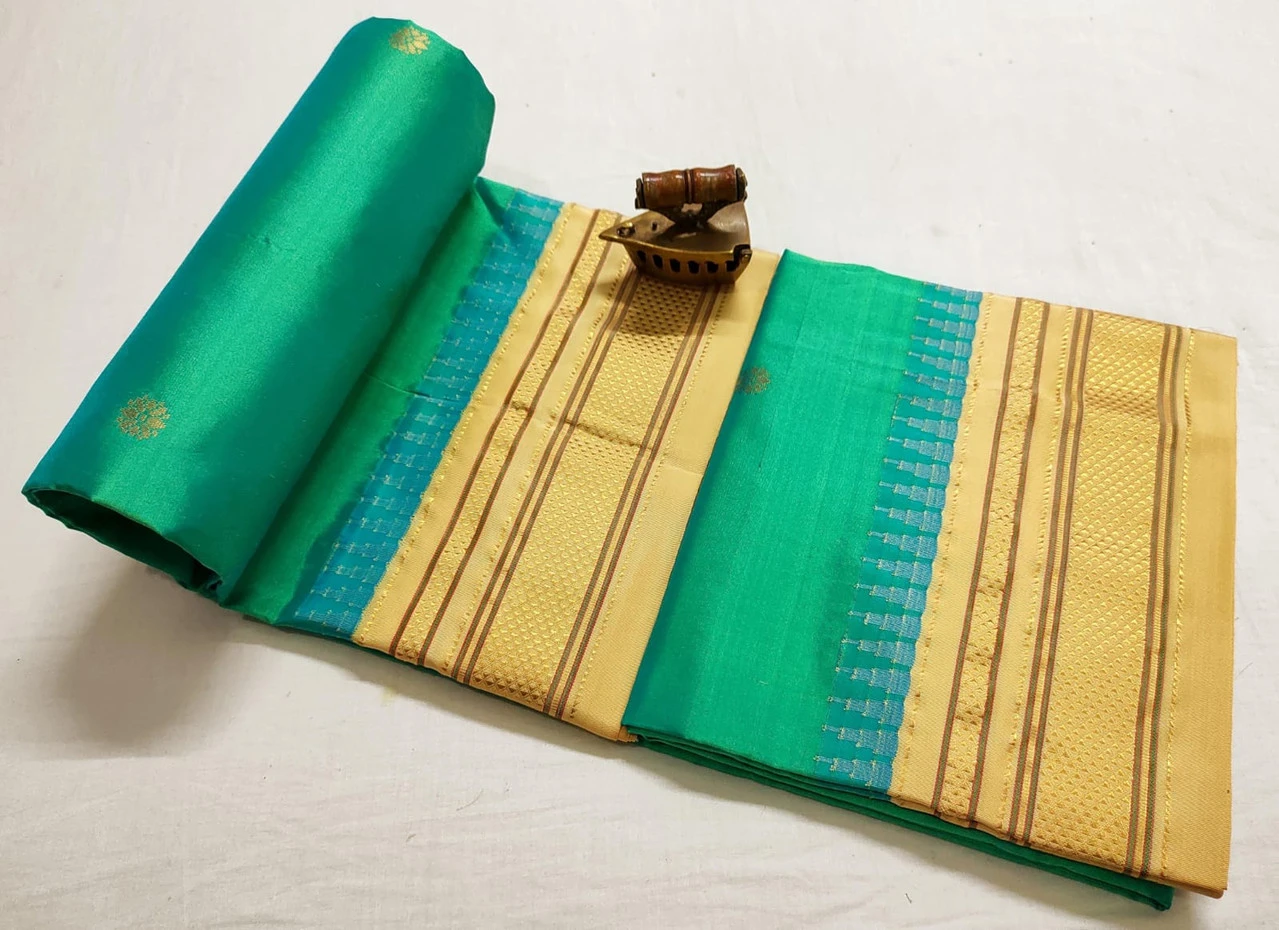 Mint Black Ilkaal Butta pure silk saree with zari border and traditional weaving