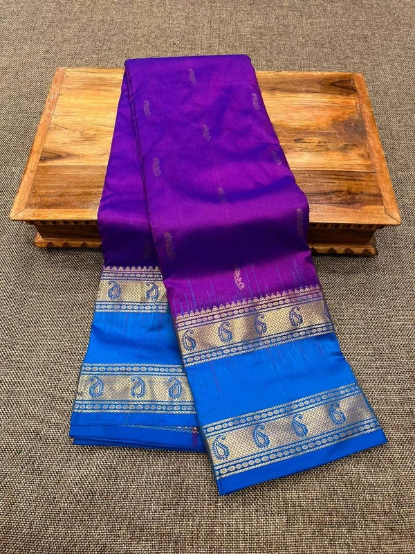 Purple Kanchipuram silk saree with blue Bentex border and gold paisley motifs.
