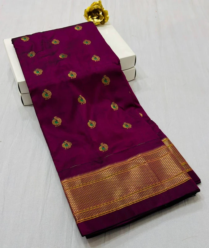 Exclusive Magenta Paithani self color pure silk saree with gold zari border, traditional Meena butta weaving and handwoven craftsmanship.
