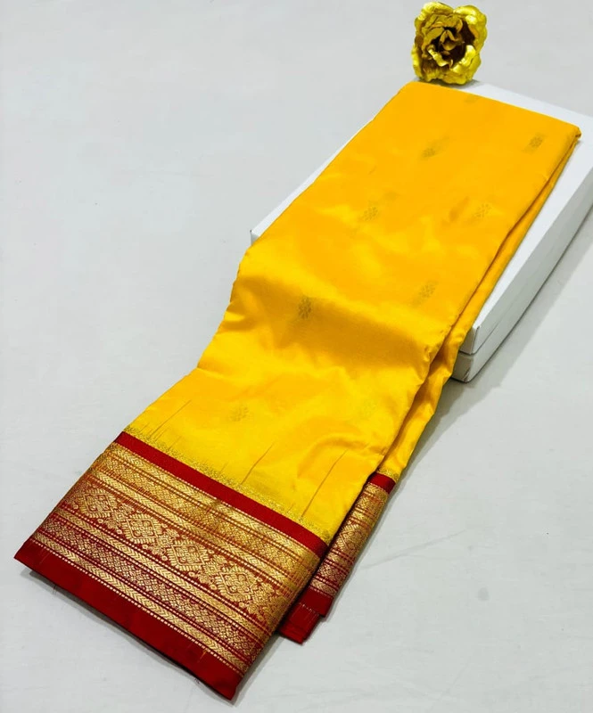Yellow Kanchipuram silk saree with red golden zari border