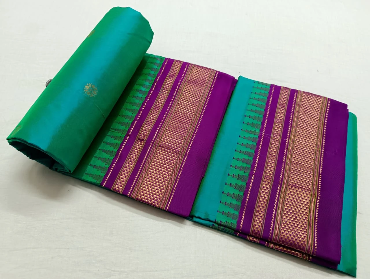 Teal Gold Ilkaal Butta pure silk saree with zari border and traditional weaving