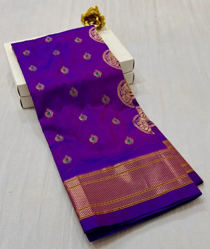 Exclusive Deep Purple Paithani self color pure silk saree with gold zari border, traditional Meena butta weaving and handwoven craftsmanship.