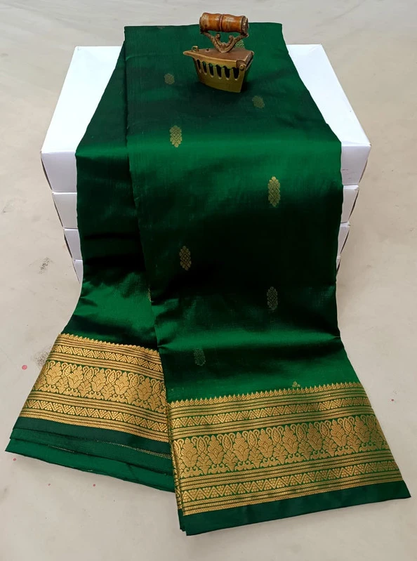 Green traditional silk saree with zari border for festive and wedding occasions