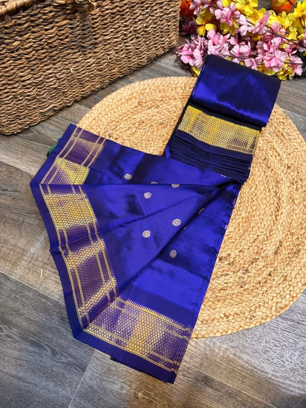 Exclusive Royal Blue Green Paithani self color pure silk saree with gold zari border, traditional Meena butta weaving and handwoven craftsmanship.