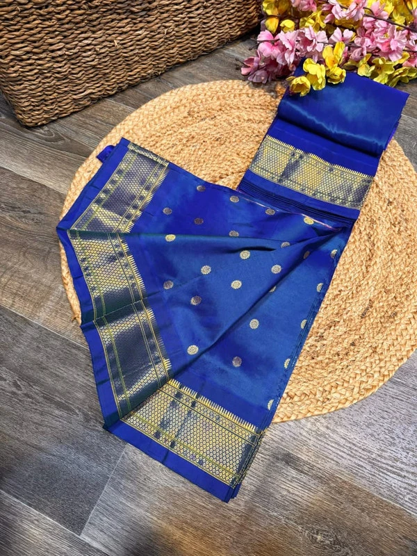 Exclusive Sky Blue Paithani self color pure silk saree with gold zari border, traditional Meena butta weaving and handwoven craftsmanship.